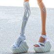 Tamikan Space Gal Kioni with Curious face, cyber leg, Stanced torso, Mediterranean skin tone