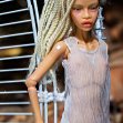 Tamikan Space Gal Kioni with Curious face, cyber leg, Stanced torso, Mediterranean skin tone