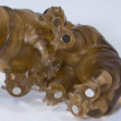 ChitinCola Tardigrade with a bowl of food